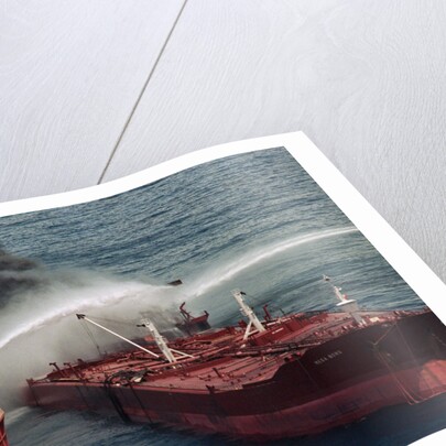 Boat Pours Water On Burning Oil Tanker by Anonymous