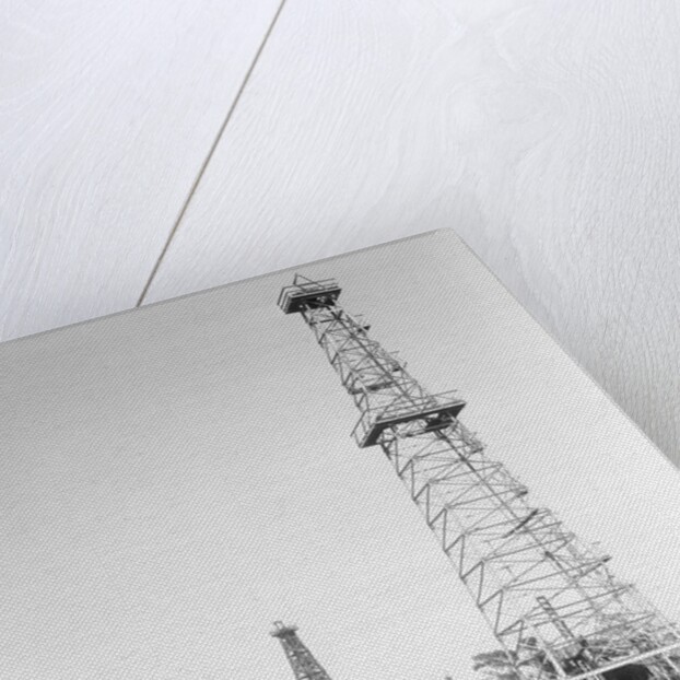 Oil Derricks In Field by Anonymous
