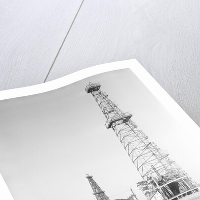 Oil Derricks In Field by Anonymous