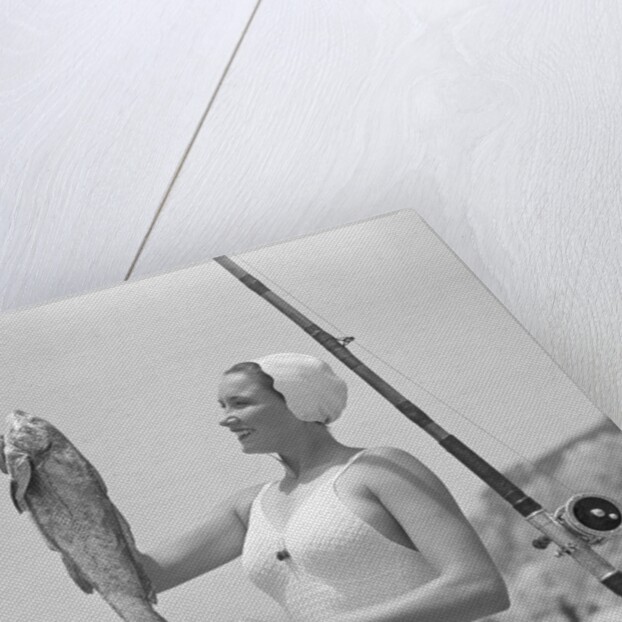 Female Fisherman Showing Her Catch by Anonymous