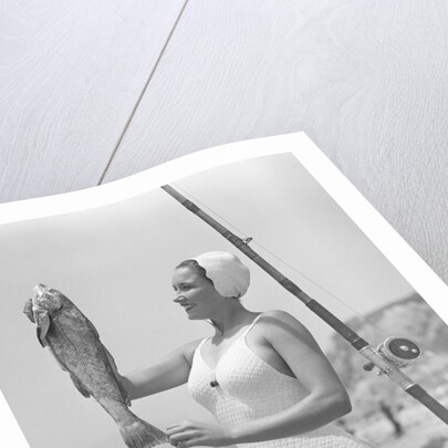 Female Fisherman Showing Her Catch by Anonymous