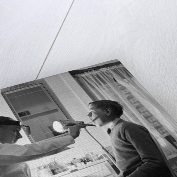 Doctor Examining Boy Patient by Anonymous