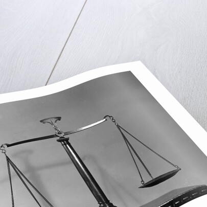 Balancing Scales On Table by Anonymous