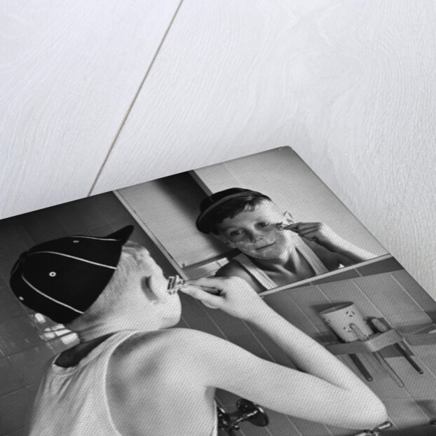 Boy Shaving at Mirror by Anonymous