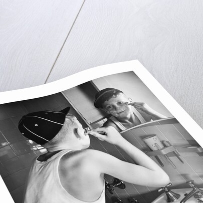 Boy Shaving at Mirror by Anonymous
