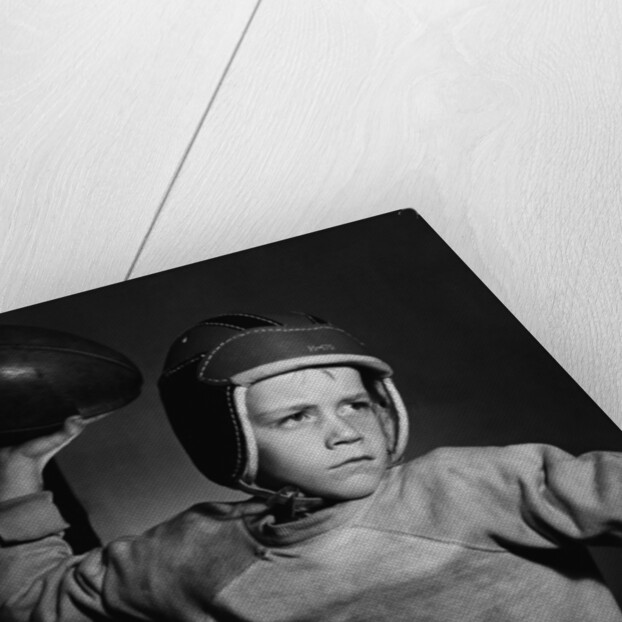 Boy Throwing a Football by Anonymous