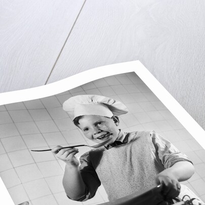 Boy Tasting His Cooking by Anonymous