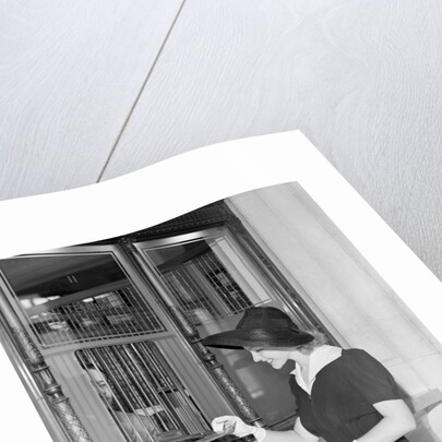 Woman At Bank Teller Window by Anonymous