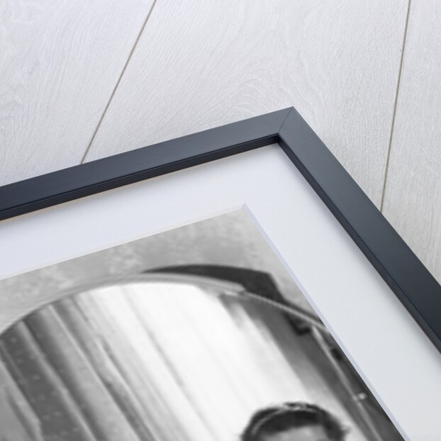 Young Woman Applying Face Cream at Vanity by Anonymous