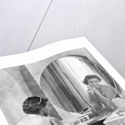 Young Woman Applying Face Cream at Vanity by Anonymous