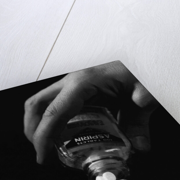 Hand Pouring Aspirin from Bottle by Anonymous