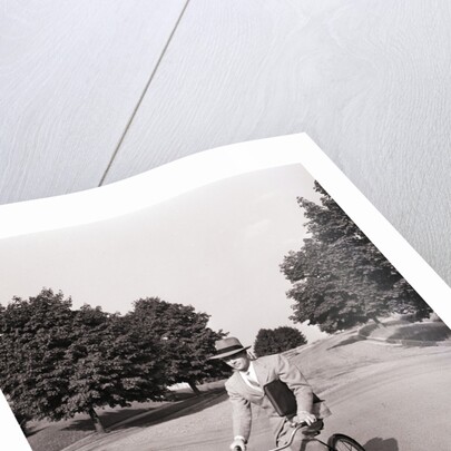 Businessman Riding a Bicycle by Anonymous