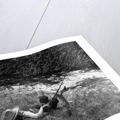 Boy Fishing with Hat Over Face by Anonymous