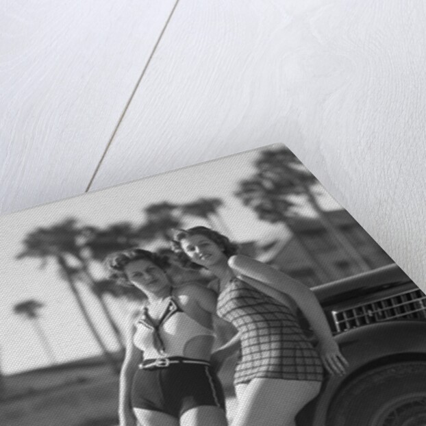 Women in Bathing Suits Leaning Against Car by Anonymous