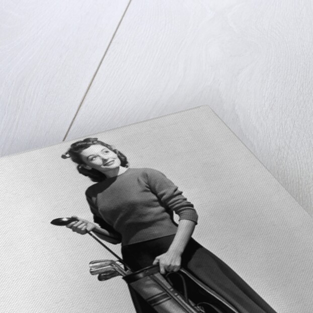 Woman Holding Golf Club And Golf Bag by Anonymous