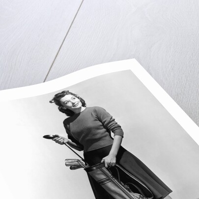 Woman Holding Golf Club And Golf Bag by Anonymous