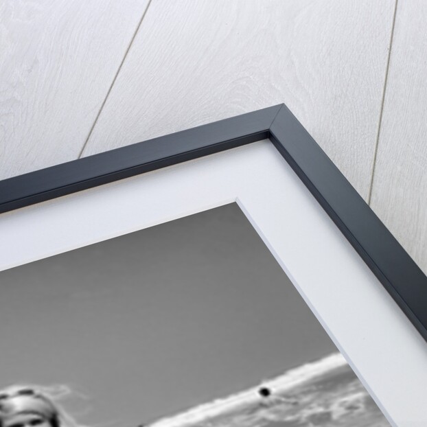 Woman Standing in Ocean Surf by Anonymous