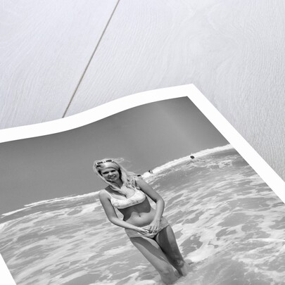 Woman Standing in Ocean Surf by Anonymous