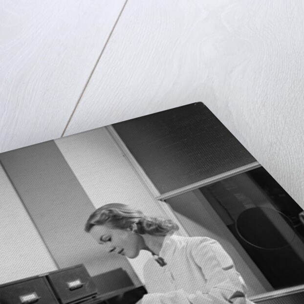 Woman and File Cabinet by Anonymous