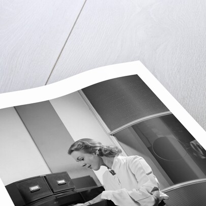 Woman and File Cabinet by Anonymous