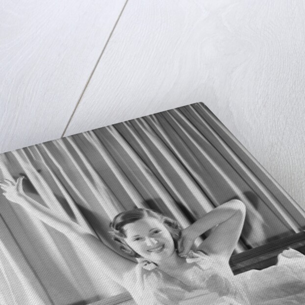 Woman Stretching in Bed by Anonymous