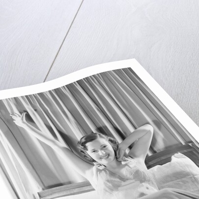 Woman Stretching in Bed by Anonymous