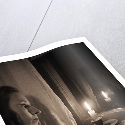 Woman at Window with Candle by Anonymous