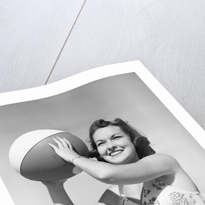 Woman Holding Beach Ball by Anonymous
