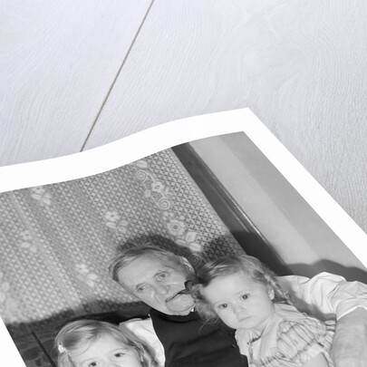 Two Girls on Grandfather's Lap by Anonymous