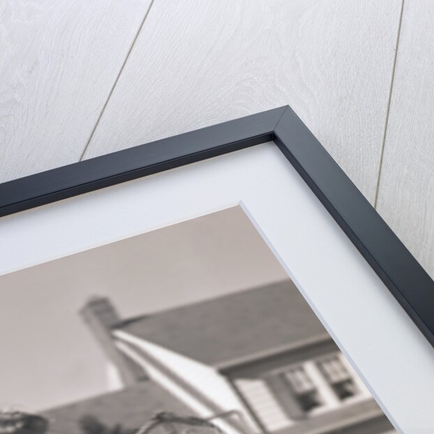 Woman Reading Mail by Mail Box by Anonymous