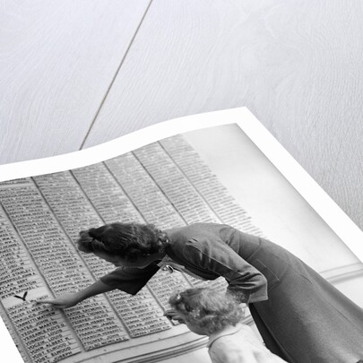 Woman And Daughter At Honor Roll Wall by Anonymous