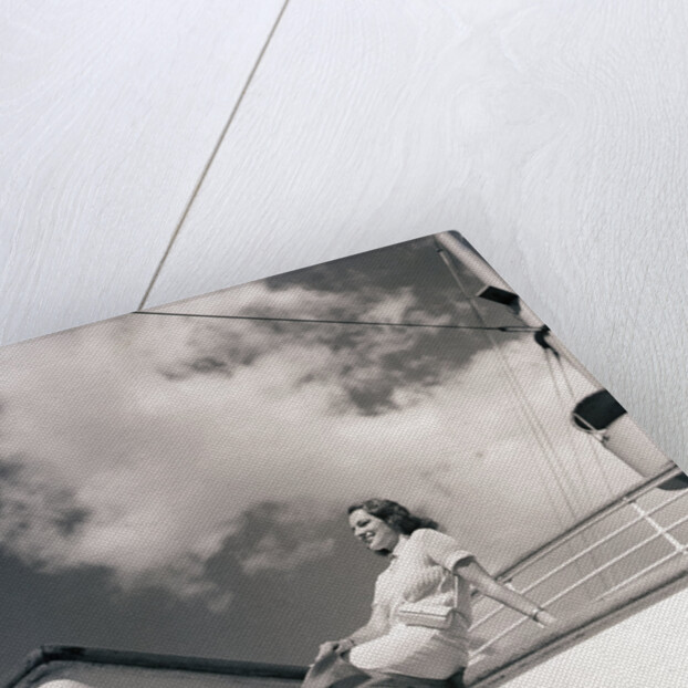 Woman Sitting on Boat Railing by Anonymous