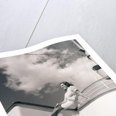 Woman Sitting on Boat Railing by Anonymous
