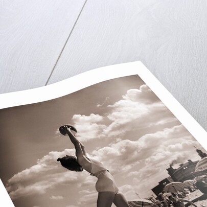 Young Woman Playing Ball On Beach by Anonymous