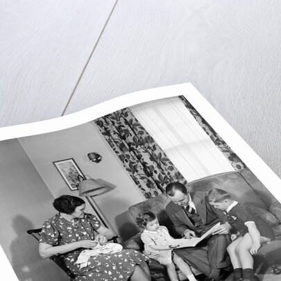 Family Sitting in Living Room by Anonymous