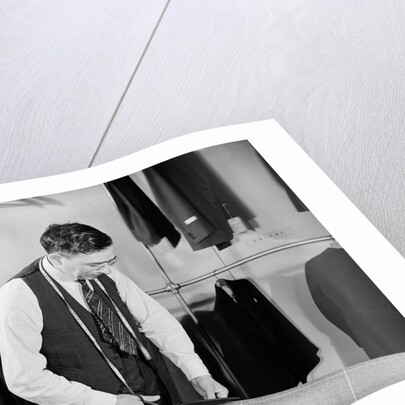 Tailor Cutting Fabric by Anonymous