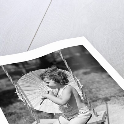Girl on Swing Holding Parasol by Anonymous