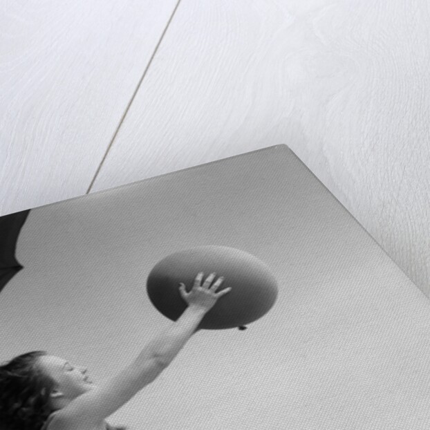 Young Woman Playing With Beach Ball by Anonymous