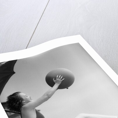 Young Woman Playing With Beach Ball by Anonymous