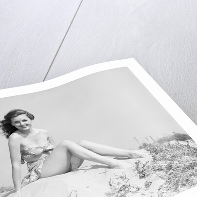 Young Woman Seated on Sand Dune by Anonymous