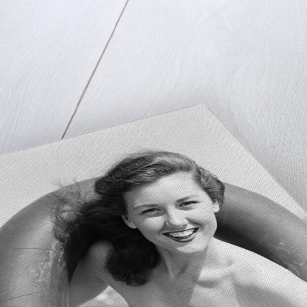 Woman with Head Through Inner Tube by Anonymous