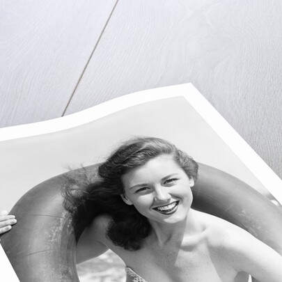 Woman with Head Through Inner Tube by Anonymous