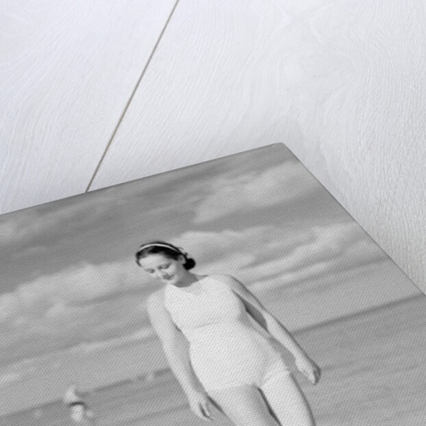 Woman Casually Strolling Along the Beach by Anonymous