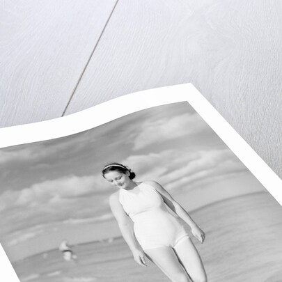 Woman Casually Strolling Along the Beach by Anonymous