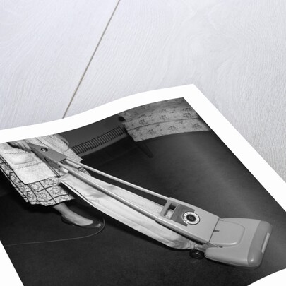 Woman Vacuuming by Anonymous