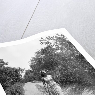Woman Walking on Country Road by Anonymous