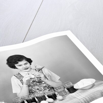 Woman Coloring Easter Eggs with a Paintbrush by Anonymous