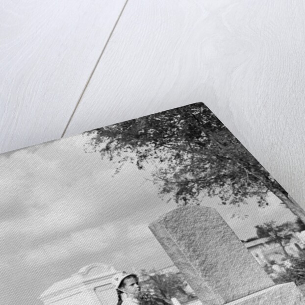 Girl Kneels at Headstone by Anonymous