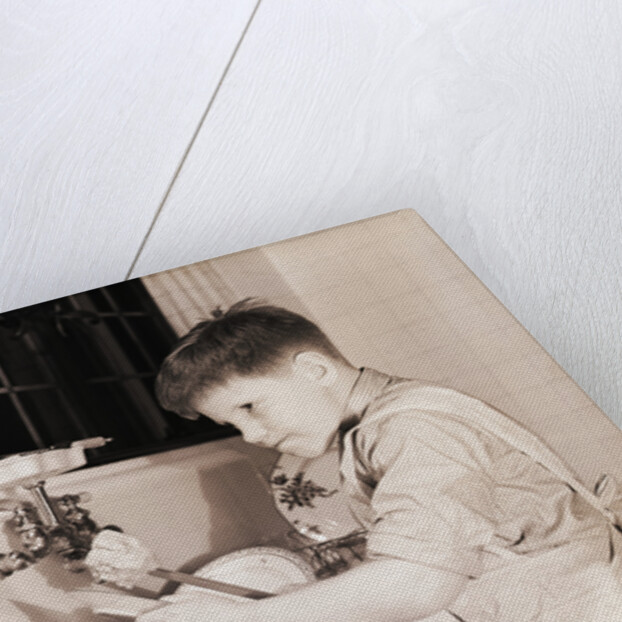 Boy Washing Dishes by Anonymous
