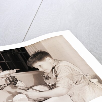 Boy Washing Dishes by Anonymous